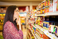 Woman looking at food shelf